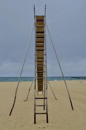 Really, really tall metal slide on Manistee Michigan beach.